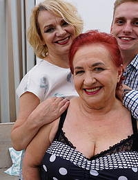 Two mature ladies sharing a young guy in an anal threesome
