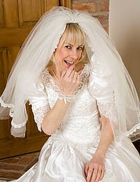 52 year old Hazel pulls off her wedding dress and spreads her ass
