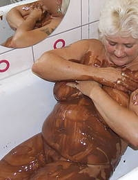 Big titted mama covered in chocolate